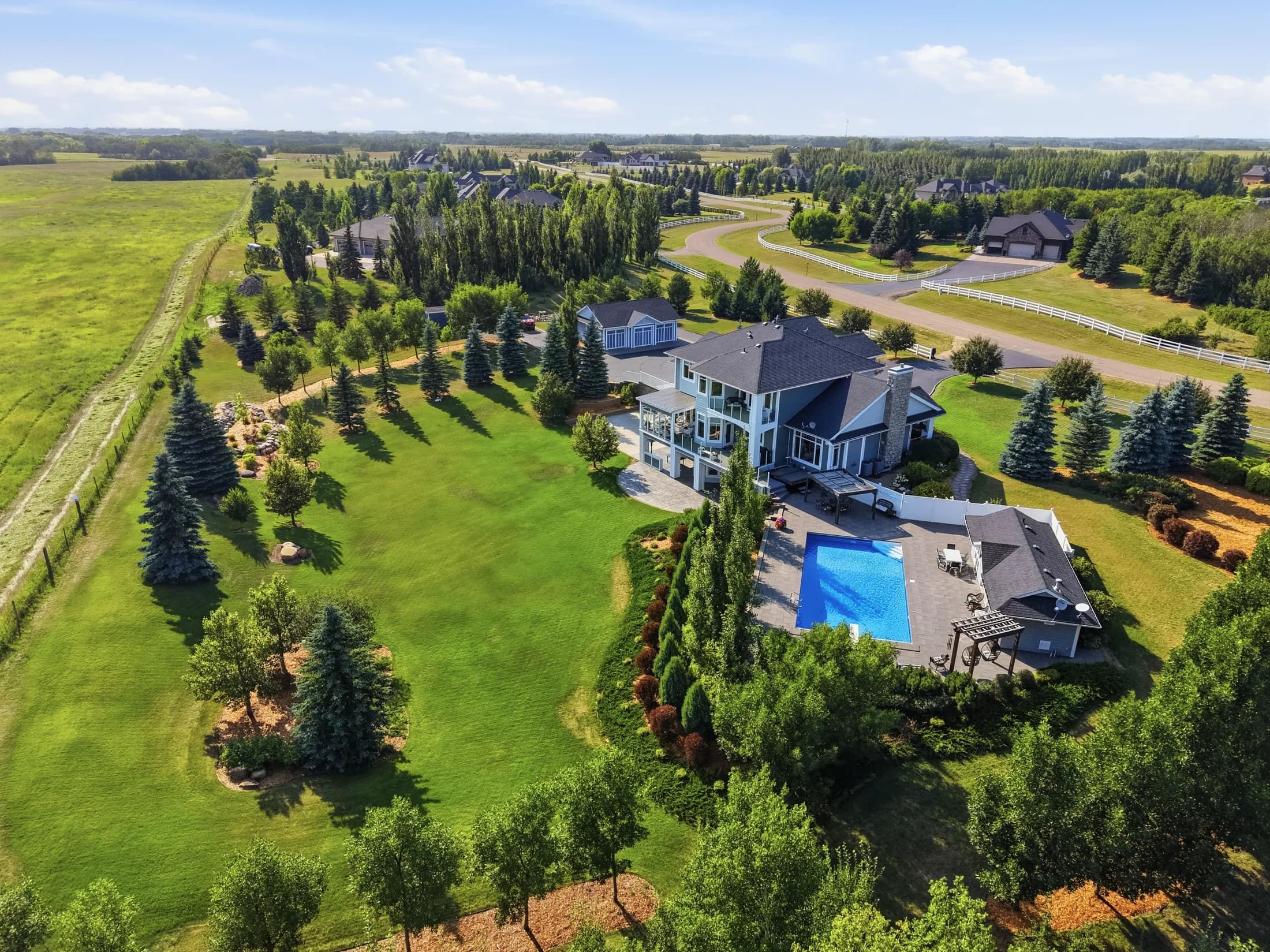 Acreage with an outdoor pool and mature trees